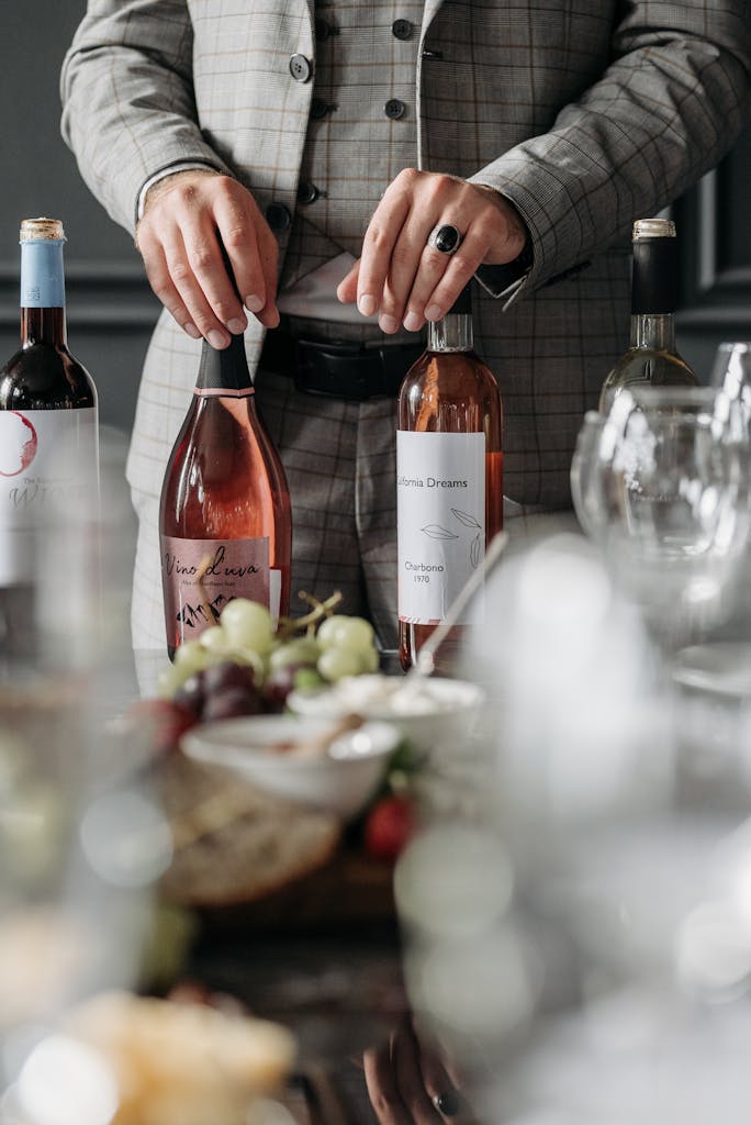 A sommelier setting up for a sophisticated wine tasting party indoors.