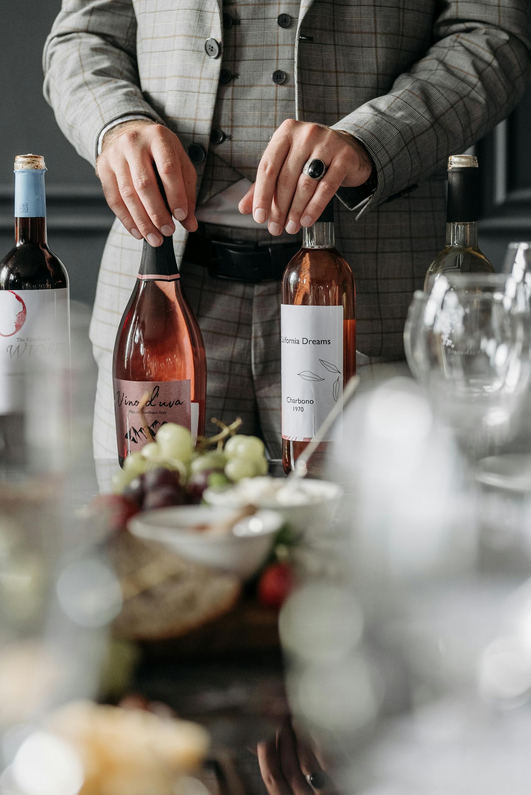 A sommelier setting up for a sophisticated wine tasting party indoors.